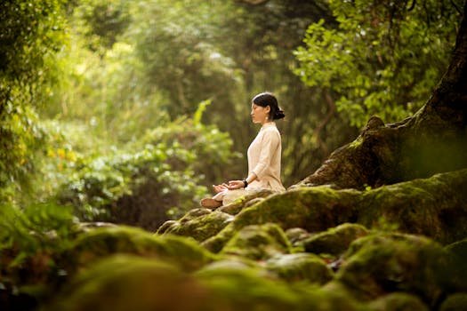 A woman in serene meditation in a lush forest, surrounded by trees and moss.